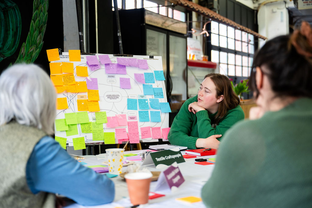 Participants reviewing a colourful community workshop map